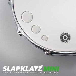 SlapKlatz MINI - all 3 sizes shown on a drum head