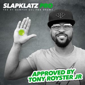 Tony Royster Jr with an alien green slapklatz in his hand