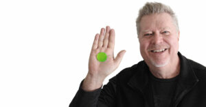 John JR Robinson holding an alien green slapklatz